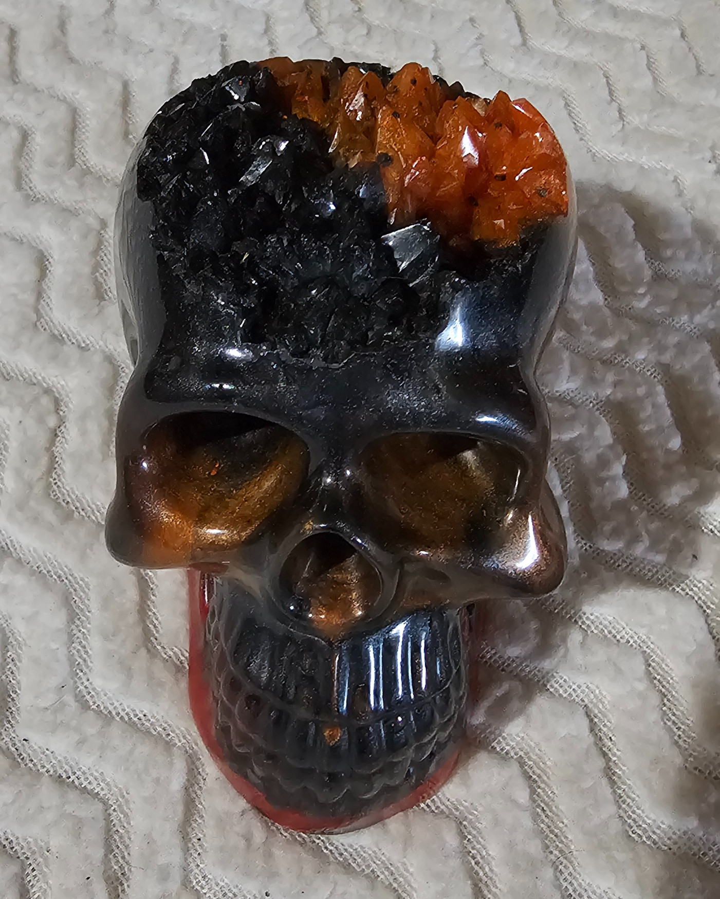 Skull black, orange, and red with crystal top