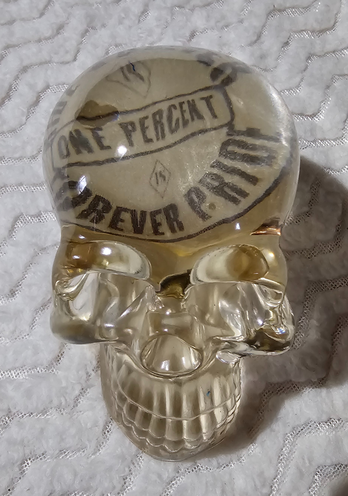 Skull with One Percent pride translucent sticker with .22 live rounds