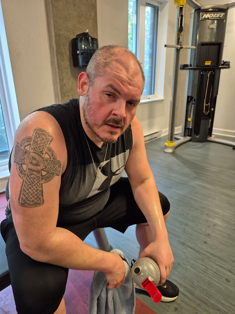 Man resting after intense gym session during Spartan race training plan, reflecting on mindset and motivation