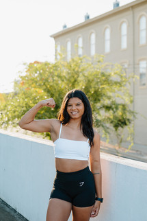 Woman doing a strength training workout guided by a personal trainer to improve functional strength