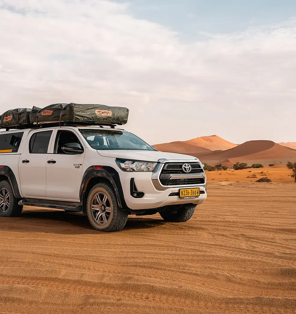Toyota-Hilux-standing-in-the-Kalahari-Desert-of-Namibia.webp