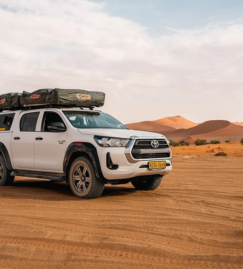 Toyota-Hilux-standing-in-the-Kalahari-Desert-of-Namibia.webp
