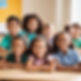 vertical position of elementary children smiling in a classroom setting.jpg
