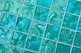High quality American made Lightstreams Glass Tile Gold Iridescent Collection Aquamarine glass tiles are a beautiful blue / green / aqua color on the shiny side of the tile, with metallic iridescent colors on the reverse side. This green tile / blue tile can be used for pool tile, spa tile, wall tile, floor tile, backsplash tile, kitchen tile, shower tile, bathroom tile, waterline tile, step marker tile, fountain tile, spillway tile, and even accent tile,