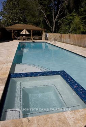American Made Lightstreams Glass Tile Renaissance Collection Peacock Blue tile is used as step marker tile, pool tile, spa tile, and waterline tile and has accent tile made from Lightstreams Jewel Accent Tiles