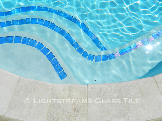American Made Lightstreams Glass Tile Renaissance Collection Sky Blue tile is used as step marker tile, accent tile for the pool steps, pool tile, and spa tile