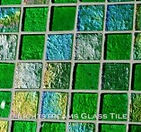 High quality American Made Lightstreams Glass Tile Renaissance Collection II Spring Green 2.0 glass tiles are bright apple green in color. There are colorful rainbow iridescent colors on the reverse textured side of the tile. This green tile can also be used for pool tile, spa tile, fountain tile, fire pit tile, wall tile, waterline tile, step marker tile, exterior tile, interior tile, accent tile, iridescent tile, backsplash tile, kitchen tile, bathroom tile, floor tile, and shower tile