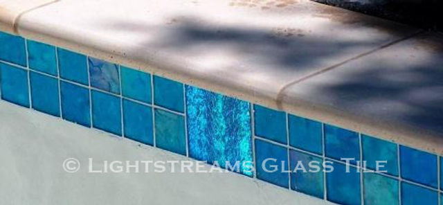 American Made Lightstreams Glass Tile Aqua Blue tile is used as pool tile, step marker tile, waterline tile, and spa tile mixed with Lightstreams accent tile Jewel Collection