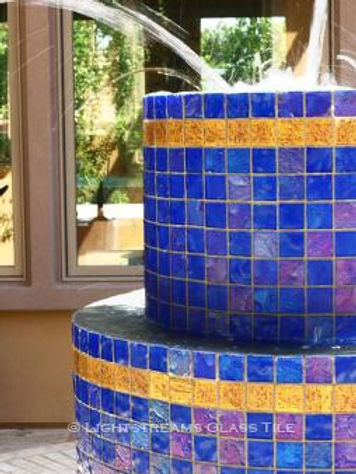 American Made Lightstreams Glass Tile Renaissance Collection Intense Blue tile is used as fountain tile for ths all glass tile outdoor fountain and has accent tile from Lightstreams 24k Gold Tile