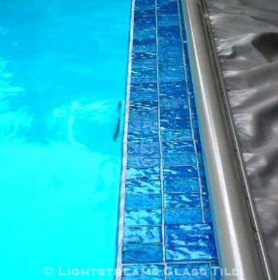 American Made Lightstreams Glass Tile Aqua Blue tile is used as pool tile, step marker tile, waterline tile, and spa tile mixed with Lightstreams accent tile Jewel Collection