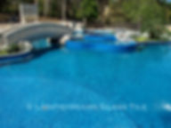 American Made Lightstreams Glass Tile Turquoise is used as pool tile, spa tile, waterline tile, bathroom tile, shower tile, and step marker blue tile with accent tile displayed around the spa around to add a stunning decorative look