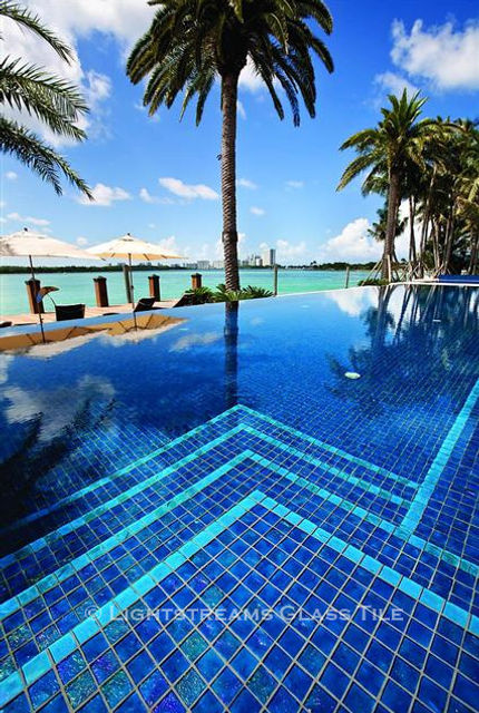 American Made Lightstreams Glass Tile Renaissance Collection Peacock is used as pool tile and spa tile for this all tile pool and all tile spa. Accent tile and step marker tile is used with Renaissance Collection Aqua Blue tile.