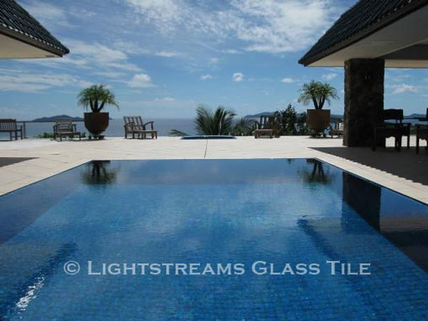 American Made Lightstreams Glass Tile Turquoise is used as pool tile for this all tile pool