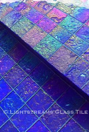 American Made Lightstreams Glass Tile Renaissance Collection Royal Blue tile for this all tile pool tile, spa tile, exterior tile at this luxury St. Lucia resort. This swimming pool tile is using only the iridescent tile side of Lightstreams Royal Blue tile
