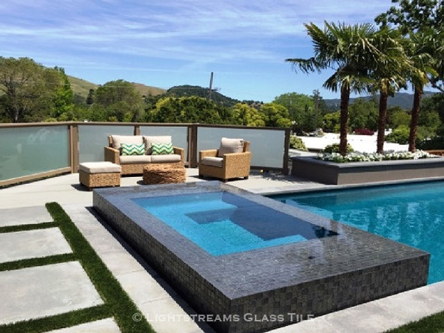 American Made Lightstreams Glass Tile Gold Iridescent Collection Silverado grey tile / silver tile is used for this all tile spa tile. Can also be used for pool tile, fountain tile, fire pit tile, wall tile, waterline tile, step marker tile, exterior tile, interior tile, accent tile, iridescent tile, backsplash tile, kitchen tile, bathroom tile, floor tile, and shower tile