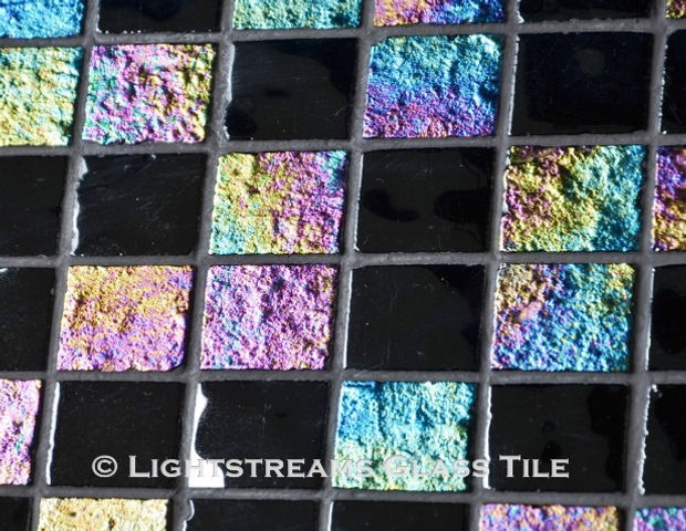 High quality American-made Lightstreams Renaissance Collection Absolute Black glass tiles are shiny black on one side, with vibrant rainbow iridescent colors on the reverse textured side. American made Lightstreams Glass Tile is used for pool tile, spa tile, waterline tile, step marker tile, accent tile, wall tile, fountain tile, floor tile, bathroom tile, shower tile, kitchen tile, and kitchen backsplash tile.