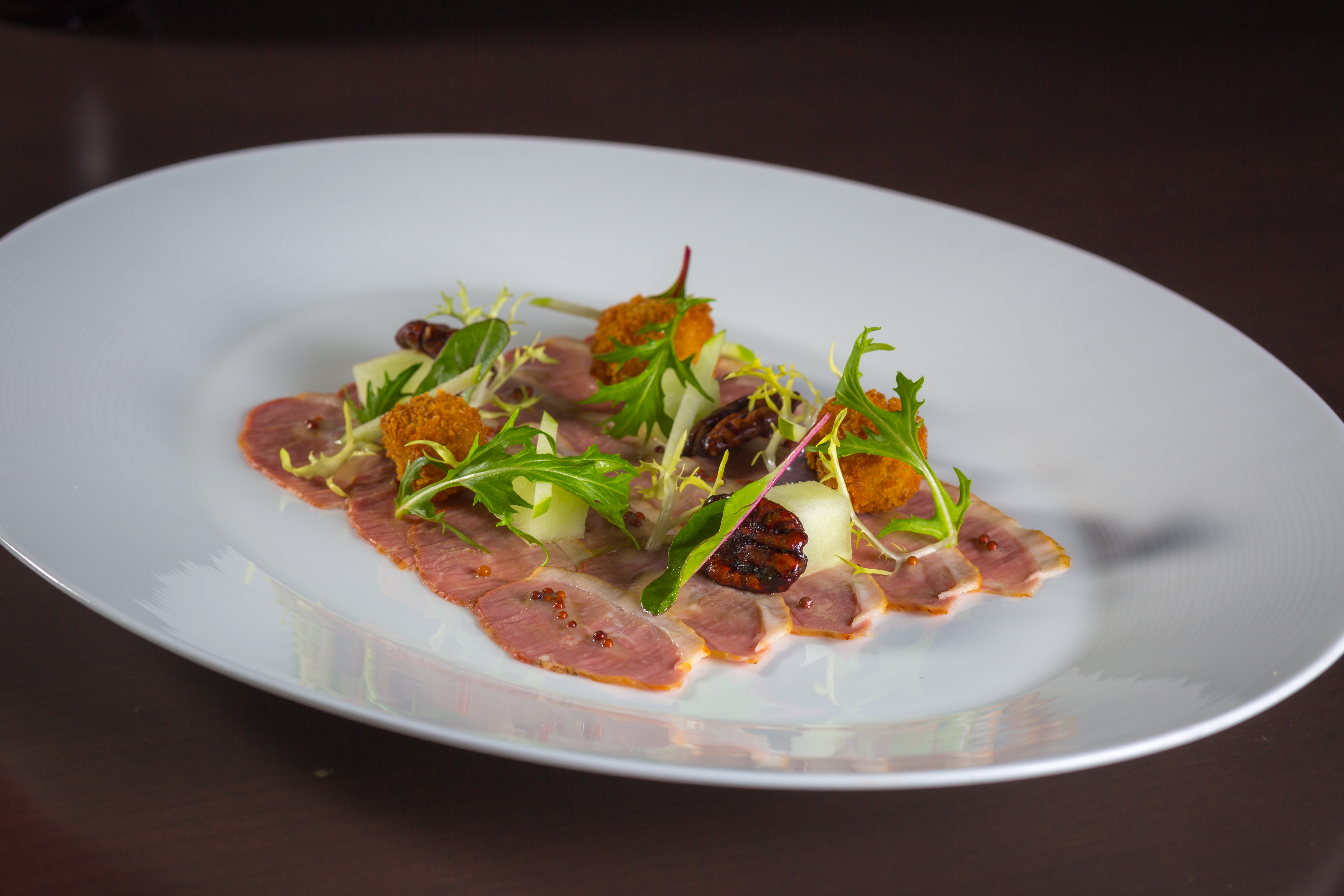 Smoked Sonoma Duck Breast foie gras “hush puppies” pecans, pickled mustard seeds content media