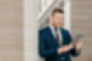 professional-male-ceo-in-elegant-suit-checks-bank-2021-10-21-03-37-24-utc.jpg