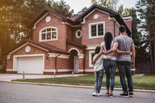 Family in front of home