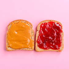 Fantastic peanut butter and jelly sandwich, top-view, close-up. Pastel background. America