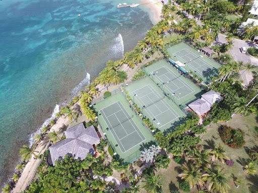 tennis courts next to the ocean