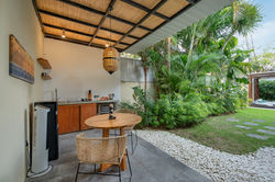 Villa Bulan covered outdoor dining area and tropical garden, Seminyak Bali