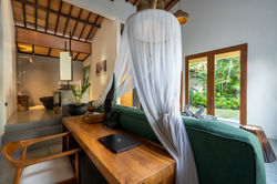 Villa Bulan canopy bed with Balinese wooden furnishings, private villa Seminyak