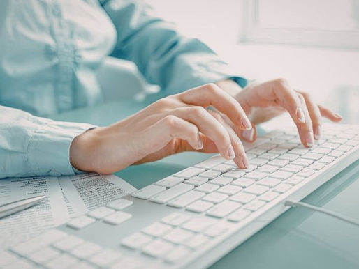 woman typing on computer