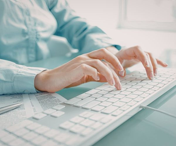 woman typing on computer
