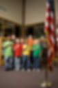Students gazing up at the American flag in class.