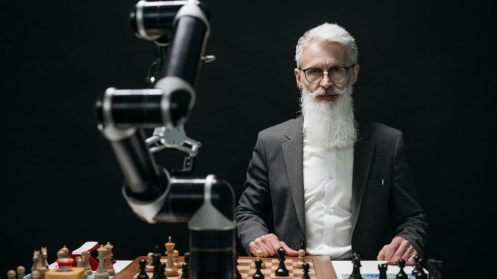 An elderly man with a long white beard and glasses, dressed in a formal suit, sits at a chessboard facing a robotic arm. The scene suggests a game of chess between human and machine, set against a dark background, highlighting the contrast between technology and tradition.