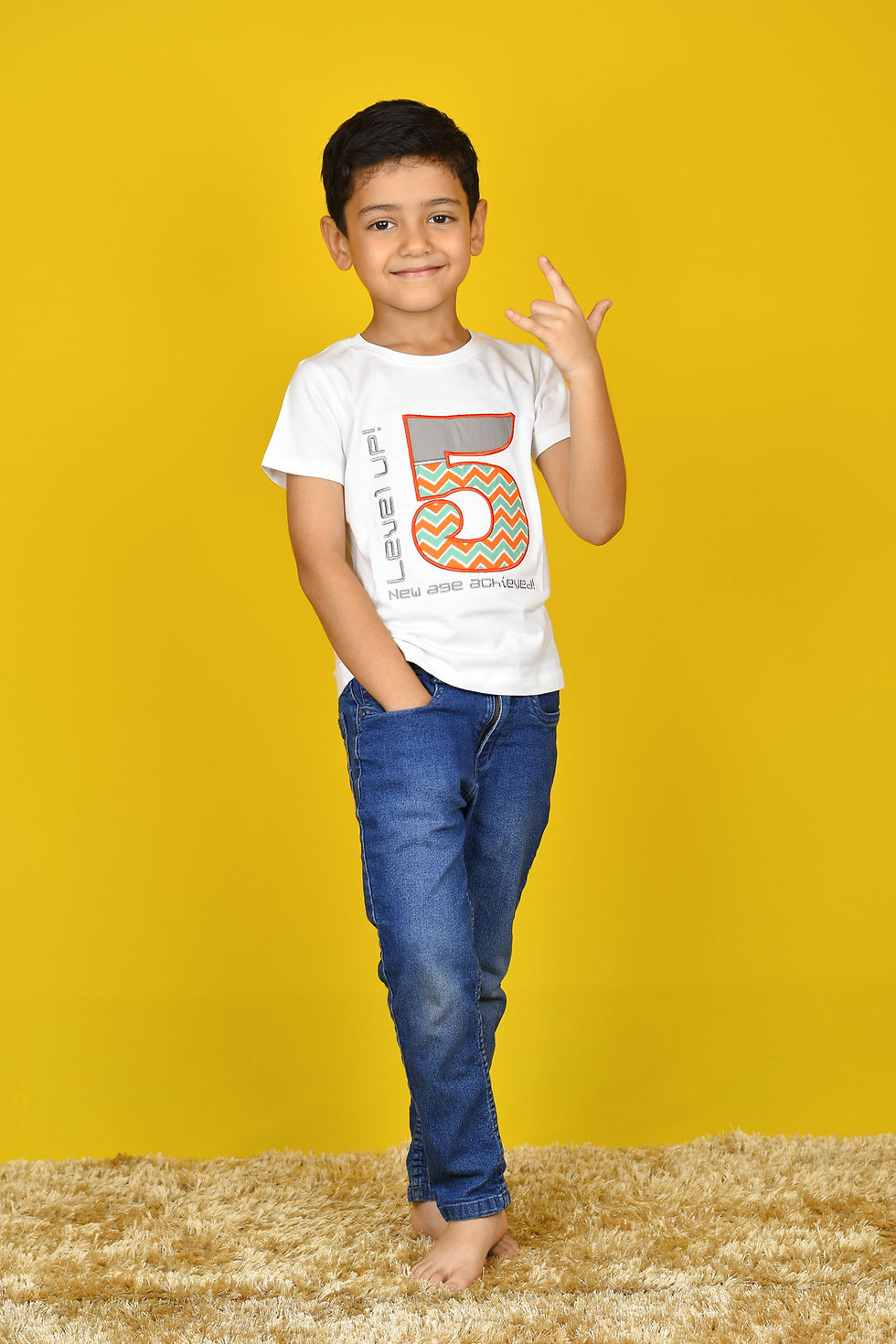 Thumbnail: another photo of a boy wearing t shirt by Hugs&Hues having number 5 and Level Up embroidered on it