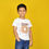 Thumbnail: a photo of a boy wearing t shirt by Hugs&Hues having number 5 and Level Up embroidered on it