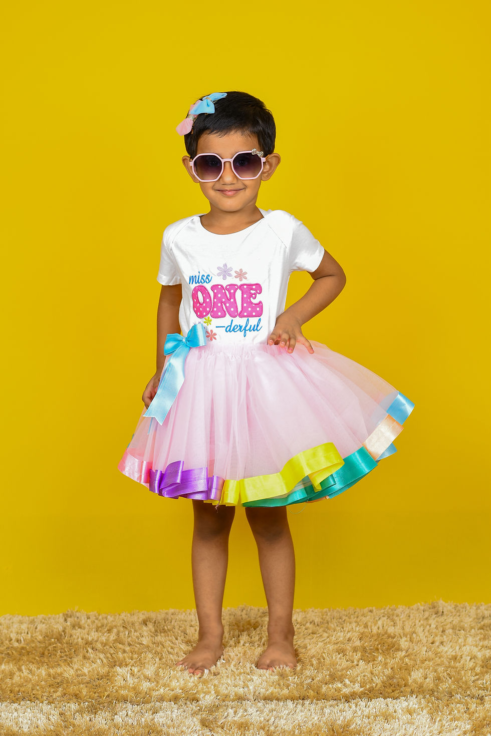 Thumbnail: another closeup photo of a girl wearing a t shirt by Hugs&Hues having "miss ONE derfull" embroidered on it and posing