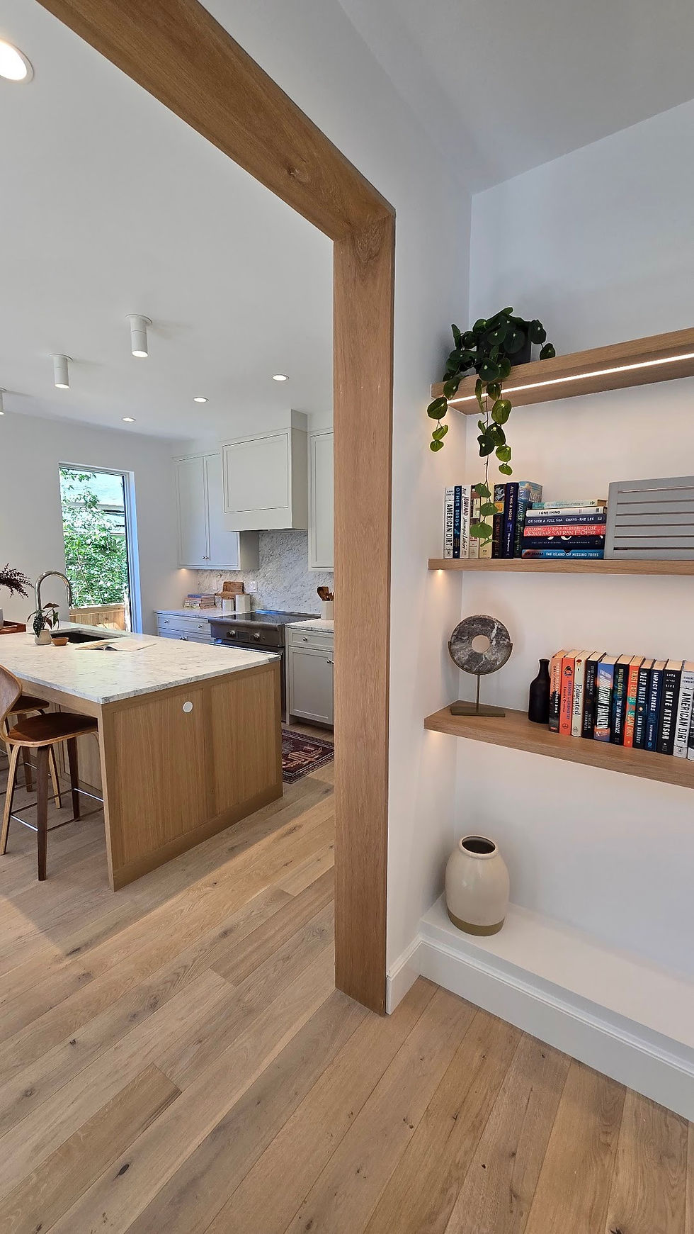 Custom white oak built-in bookshelves by Heartwood Millwork