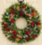 Traditional, bespoke fresh Christmas wreath with red decoration