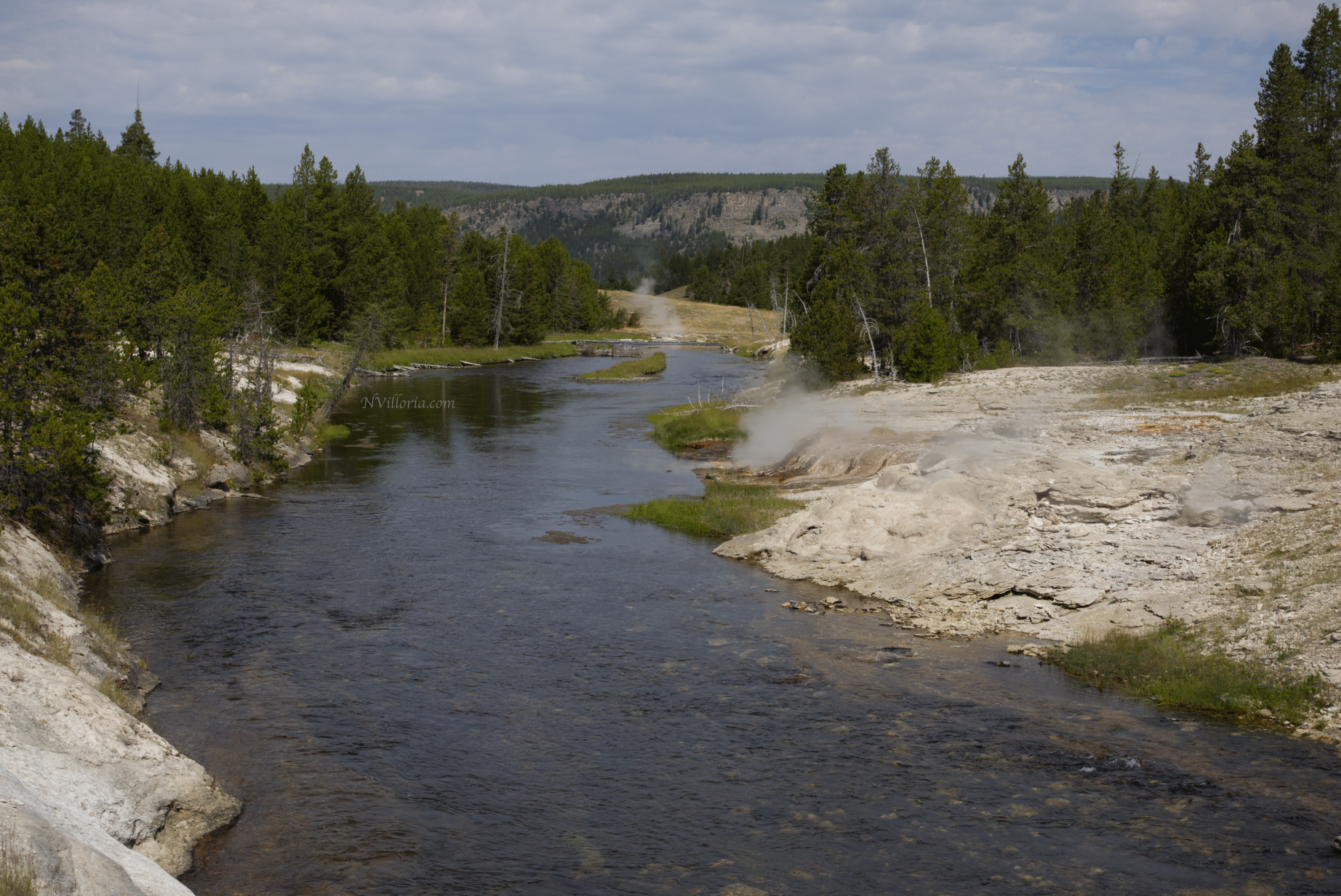 a river with steam vents at Yellowstone National Park - via NVilloria.com