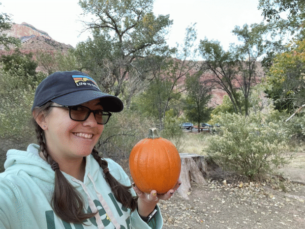 Someone holding a pumpkin at Zion National Park via travel blogger NVilloria.com