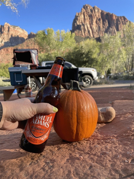 A beer bottle toasting a pumpkin via travel blogger NVilloria.com