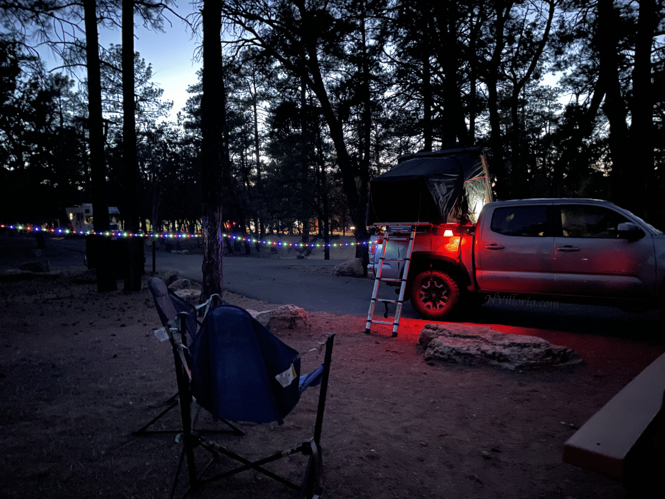 a campground at night with glowing lights - via NVilloria.com