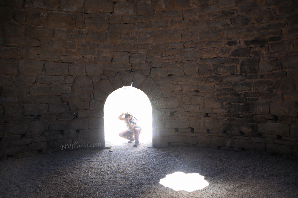 Nikki taking a photo of the inside of a structure at the Ward Charcoal Ovens - via NVilloria.com