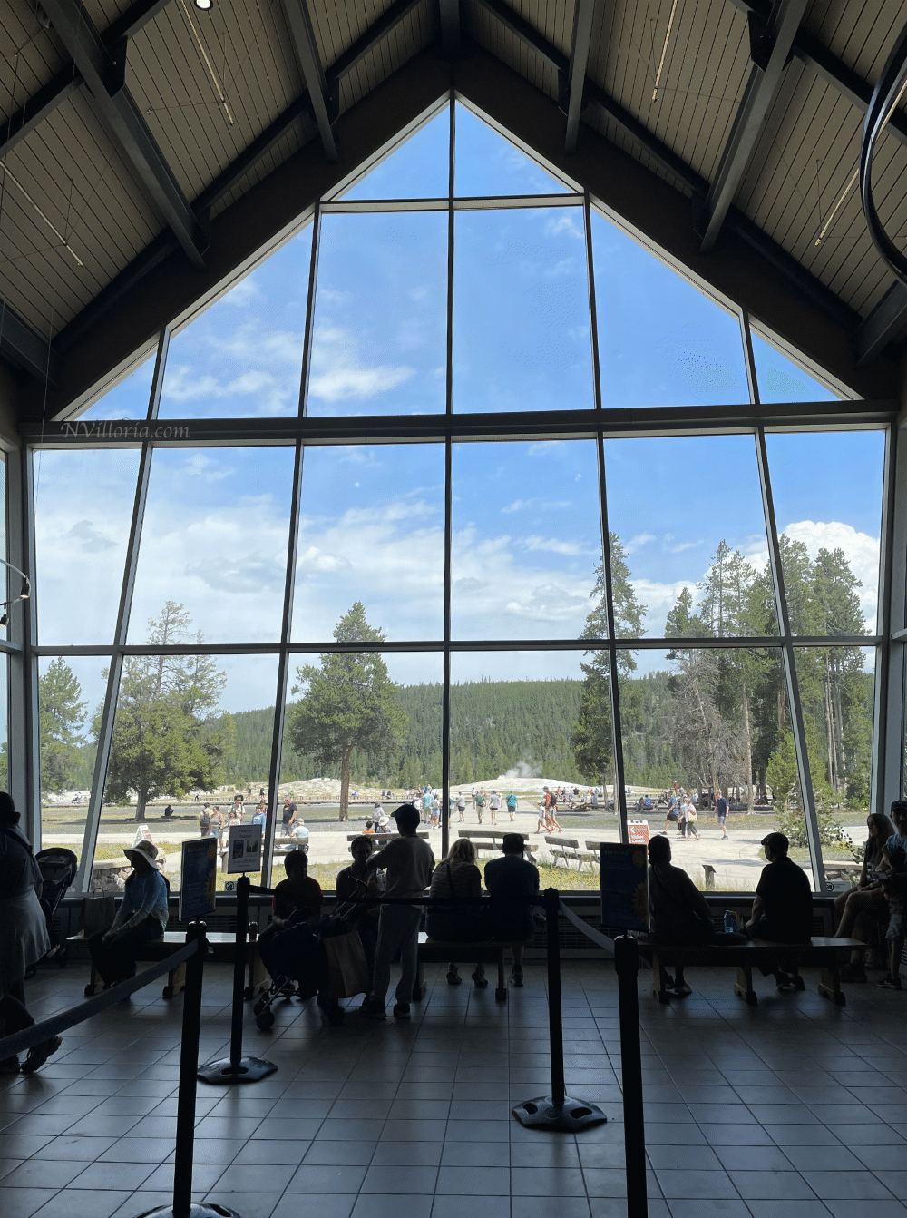 Views through the visitor center windows to Old Faithful in Yellowstone National Park - via NVilloria.com