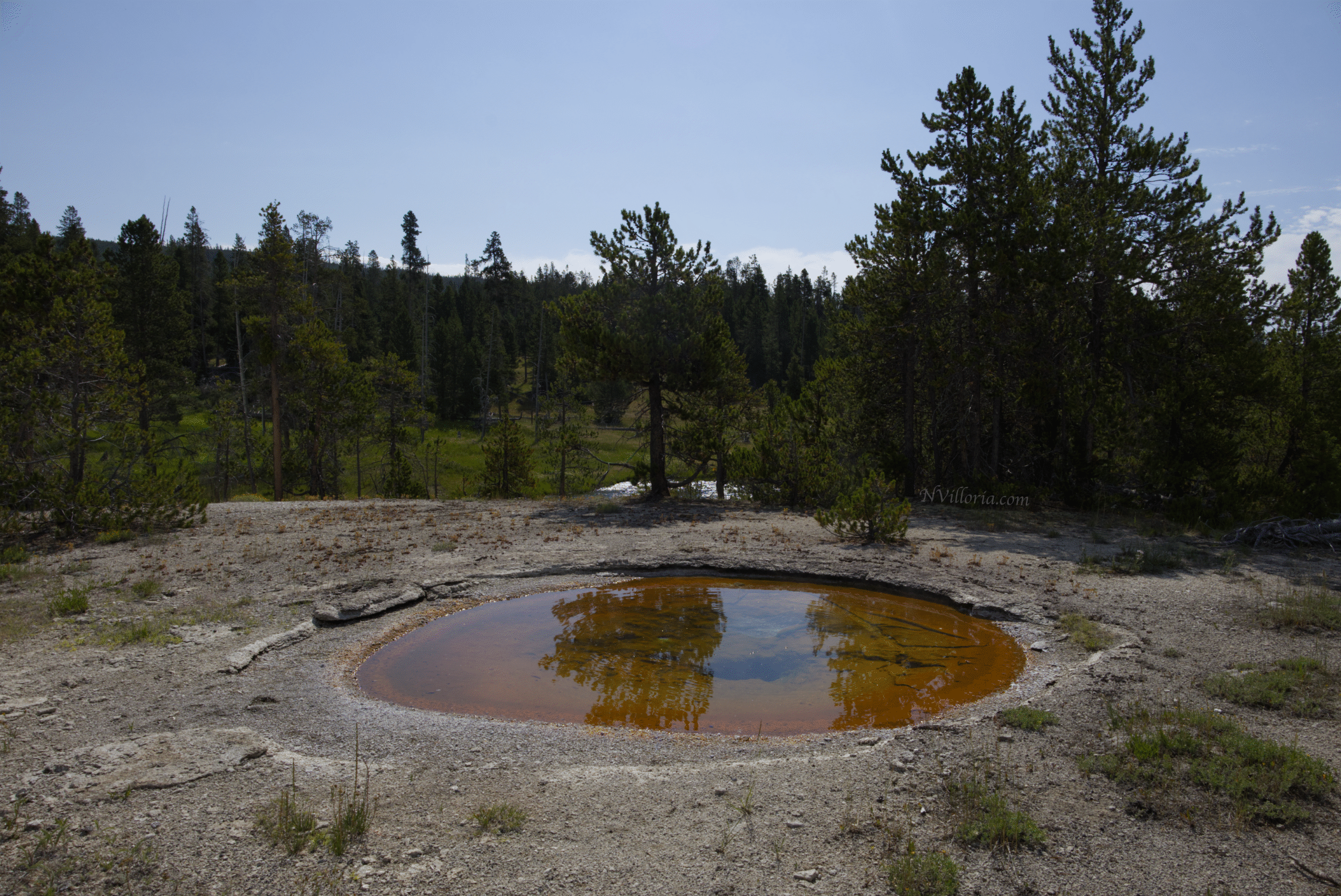 a colorful geyser pool at Yellowstone National Park - via NVilloria.com