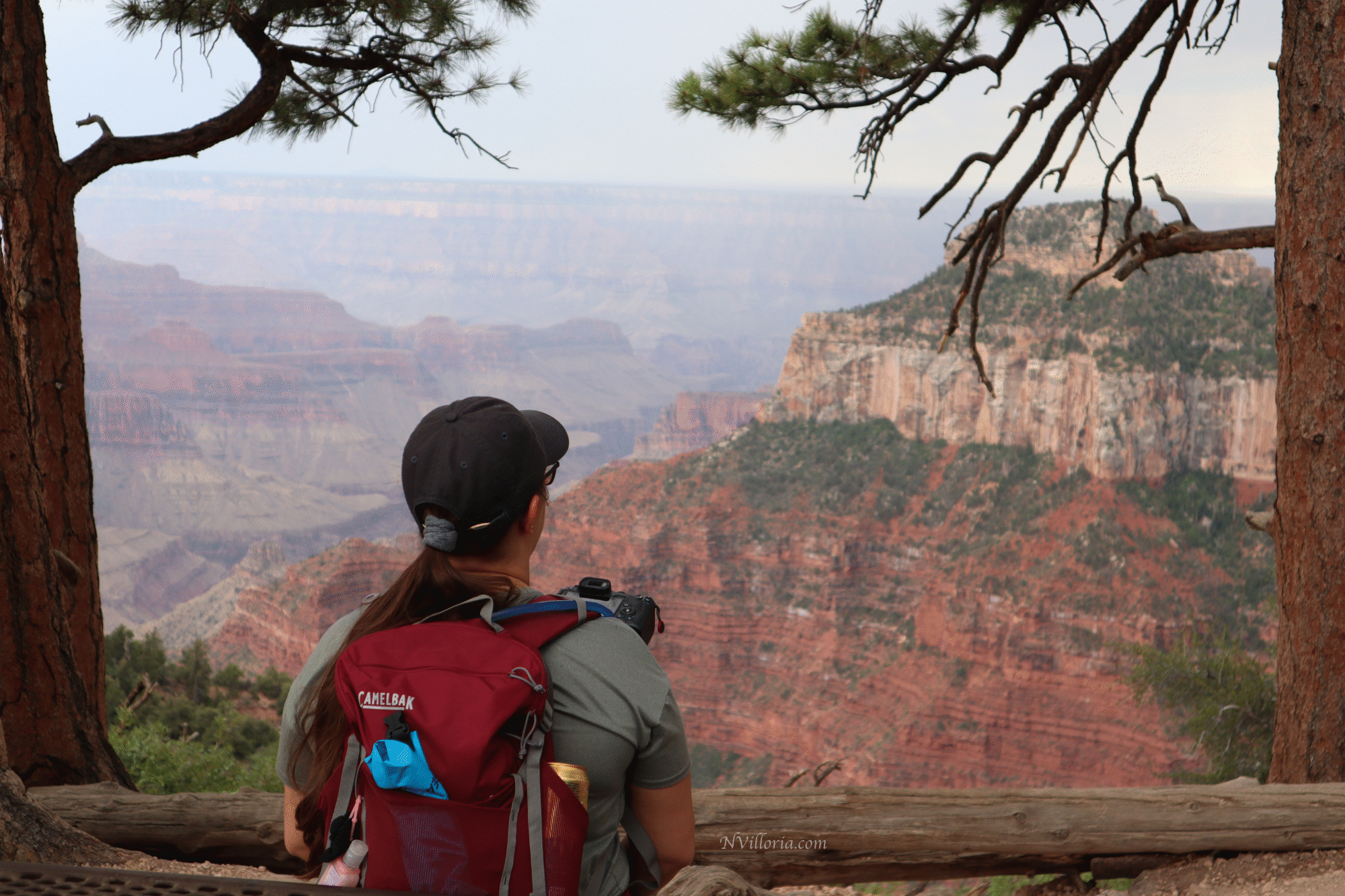 Nikki in hiking gear looking out over the views at the Grand Canyon North Rim - via NVilloria.com