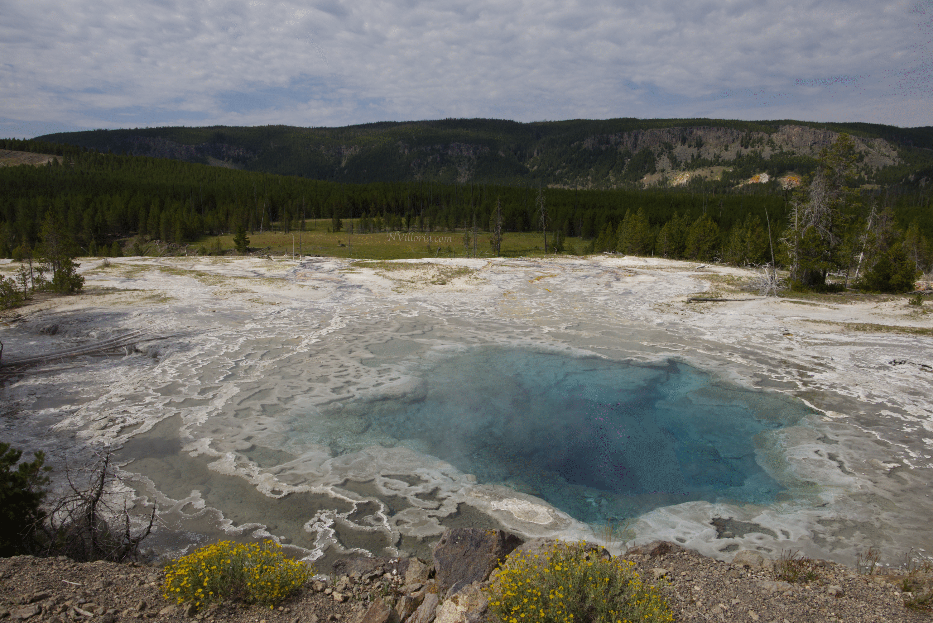 a large geyser pool at Yellowstone National Park - via NVilloria.com
