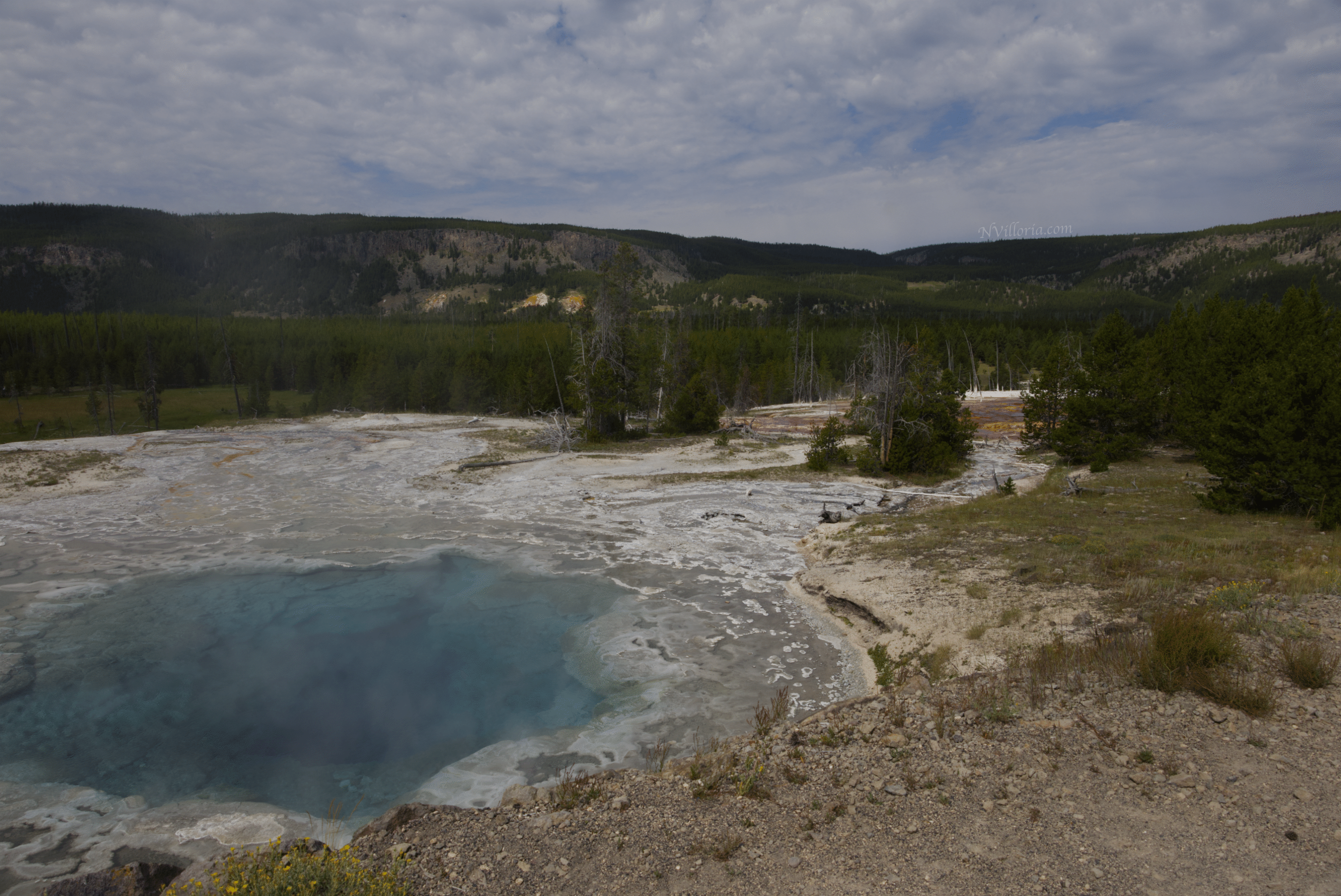 a large geyser pool at Yellowstone National Park - via NVilloria.com