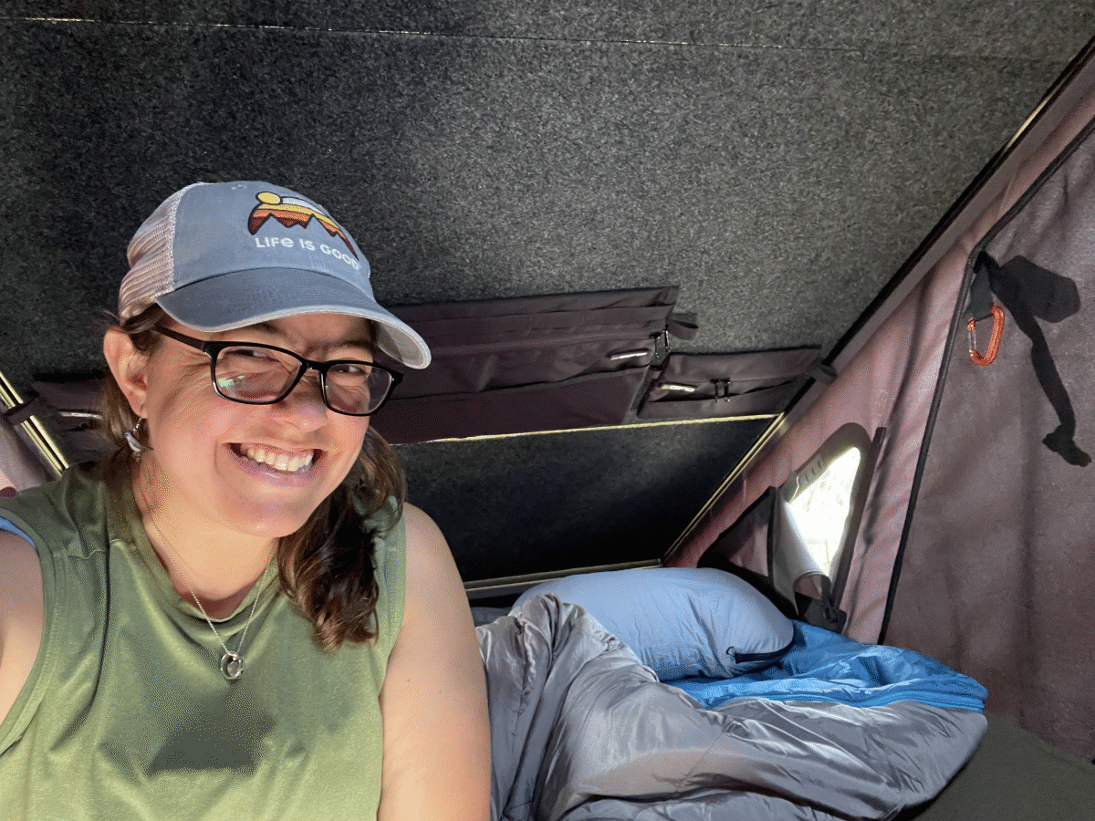 Nikki smiling and sitting inside the Go Fast Camper - via NVilloria.com