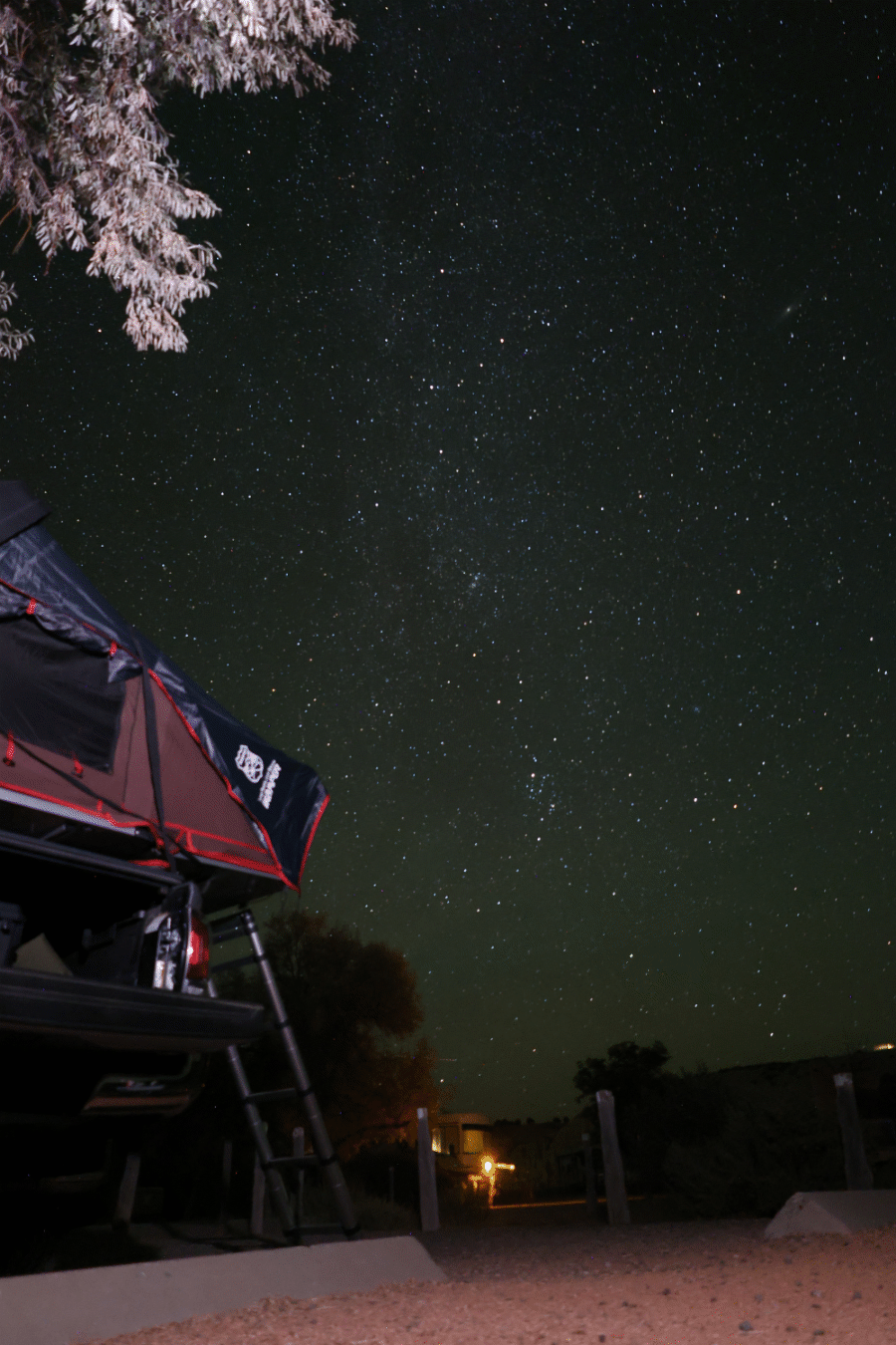 iKamper Skycamp Mini on a 5-foot bed Toyota Tacoma under a night sky of stars - via NVilloria.com 