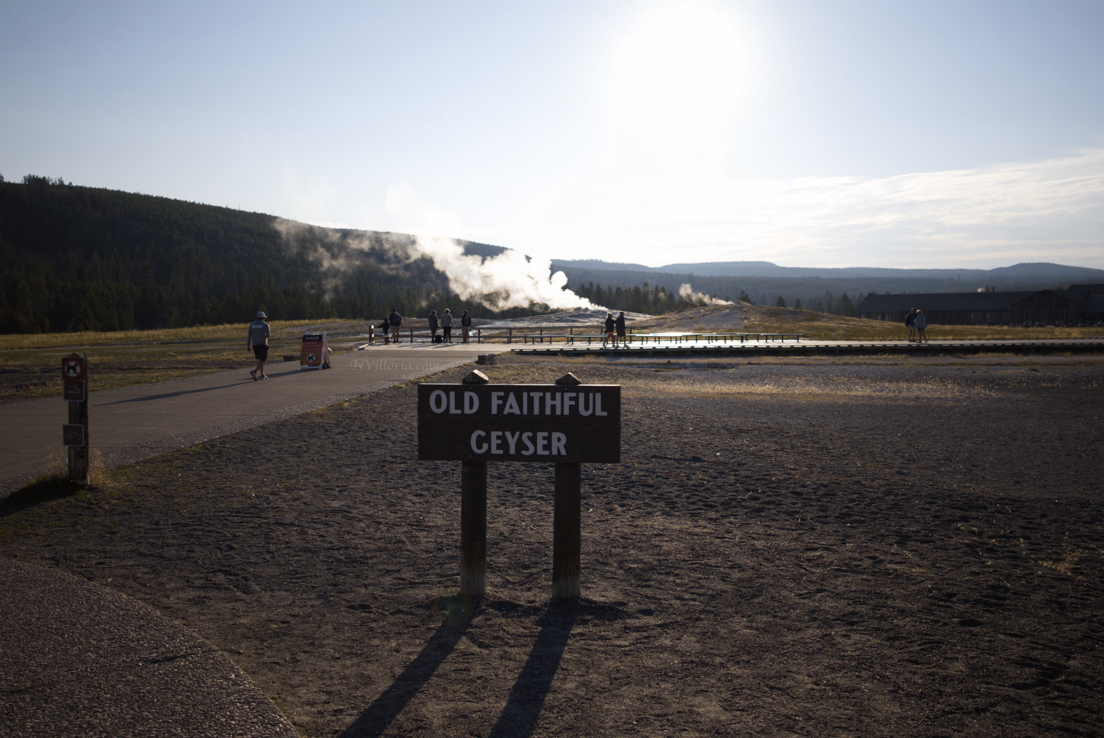 Old Faithful sign and geyser at Yellowstone National Park - via NVilloria.com