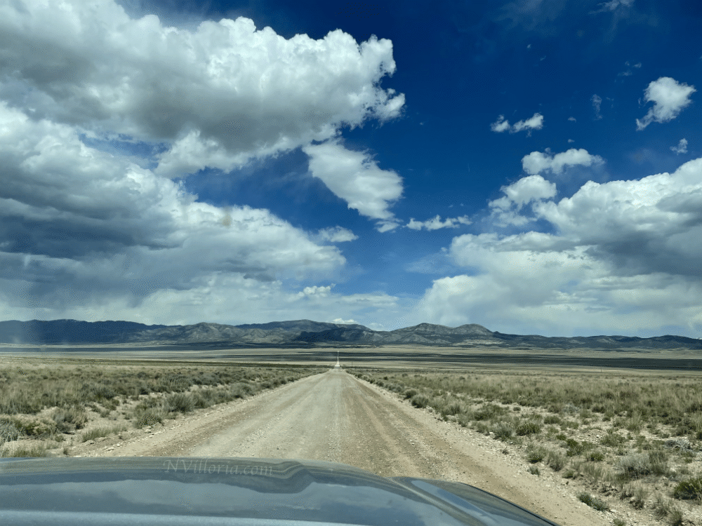 A long dirt road in the Nevada desert - via NVilloria.com